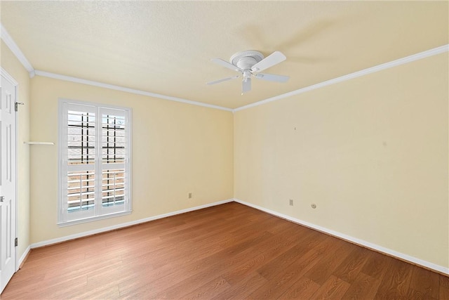 empty room with a textured ceiling, light wood-type flooring, ceiling fan, and crown molding