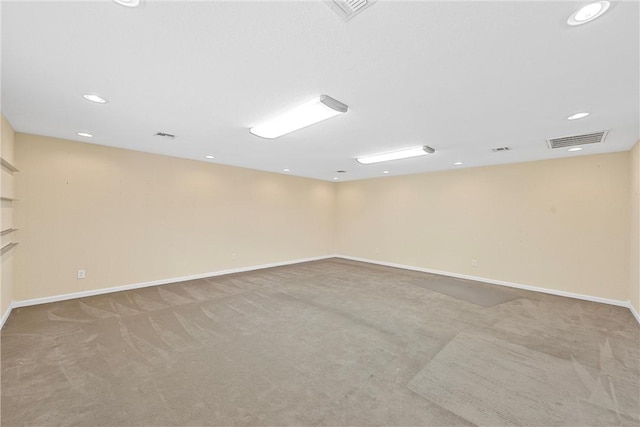 empty room featuring light carpet