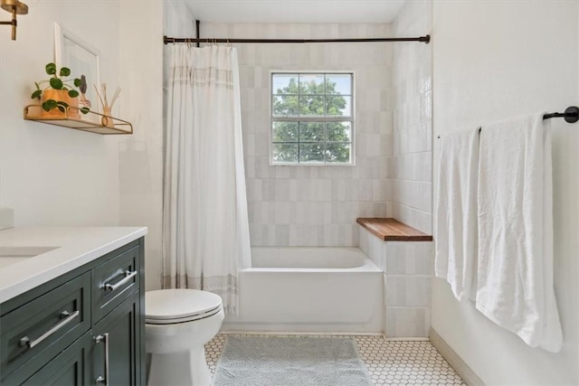 full bathroom featuring tile patterned floors, vanity, toilet, and shower / bath combo