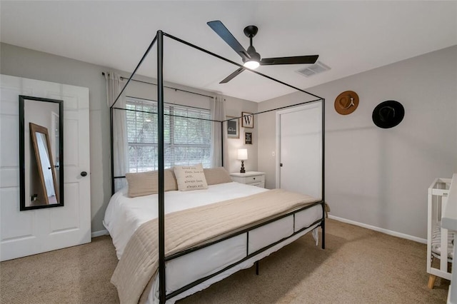 carpeted bedroom featuring ceiling fan