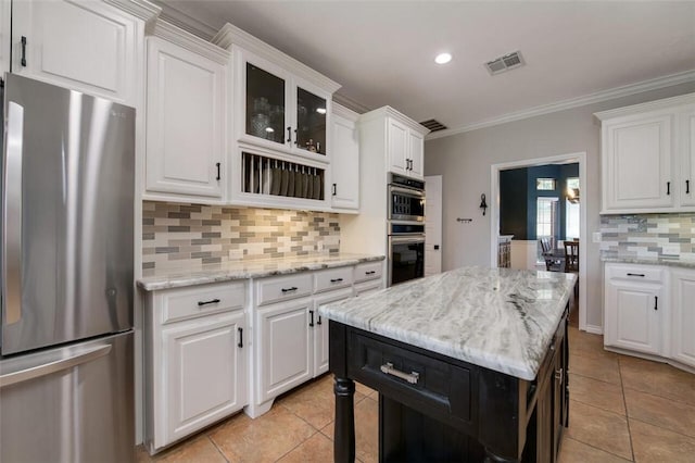 kitchen featuring white cabinetry, crown molding, and appliances with stainless steel finishes