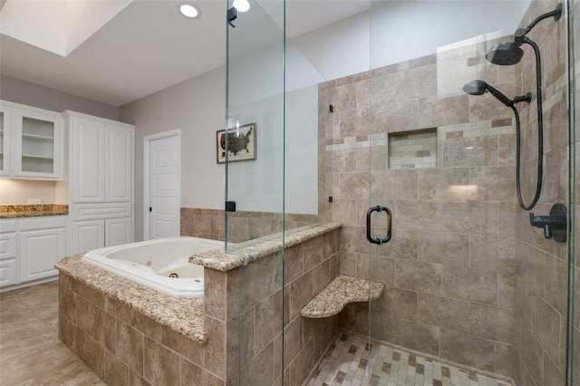 bathroom with tile patterned flooring and plus walk in shower