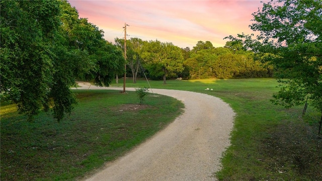 view of home's community featuring a lawn