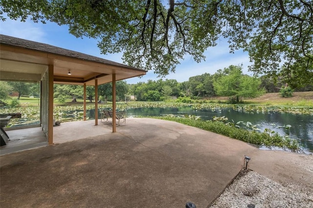 view of patio featuring a water view