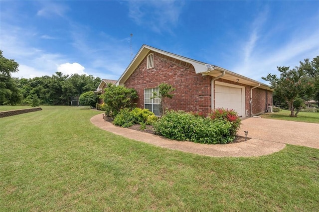 view of home's exterior featuring a yard and a garage