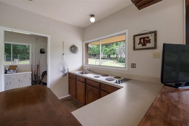 kitchen with sink and white cooktop