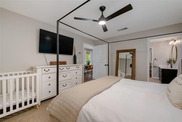 carpeted bedroom with ceiling fan