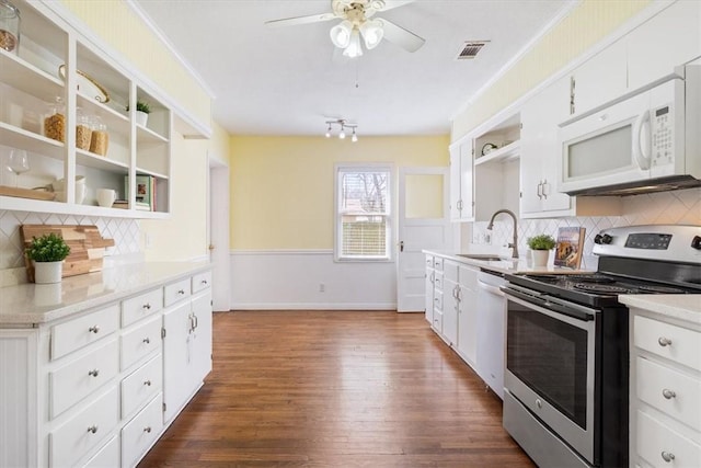 kitchen with visible vents, open shelves, a sink, white appliances, and ceiling fan