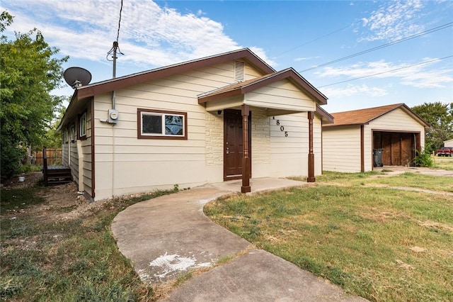 bungalow-style home featuring a front yard and a garage