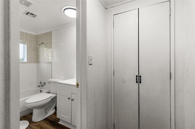 full bathroom featuring hardwood / wood-style flooring, toilet, vanity, and ornamental molding