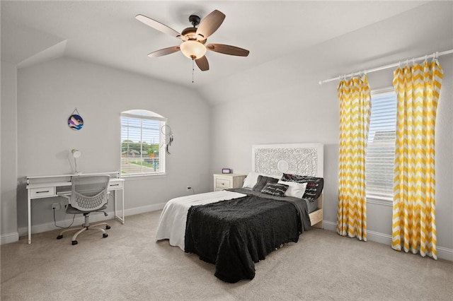 bedroom with a ceiling fan, lofted ceiling, carpet flooring, and baseboards