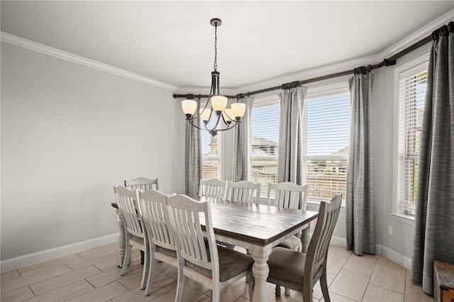 dining area with baseboards, ornamental molding, light wood-style flooring, and a notable chandelier