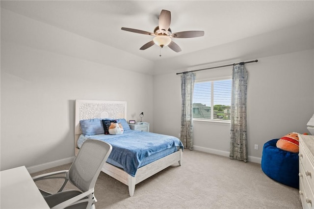 bedroom with baseboards, a ceiling fan, and light colored carpet