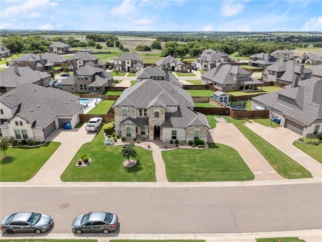 birds eye view of property with a residential view