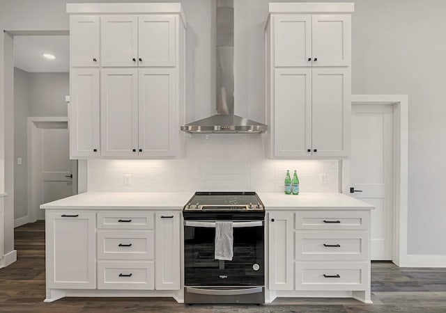 kitchen featuring white cabinets, wall chimney range hood, and stainless steel range with electric cooktop