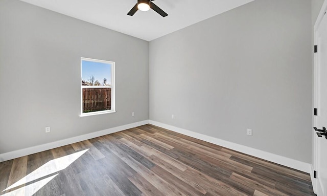 empty room with wood-type flooring and ceiling fan