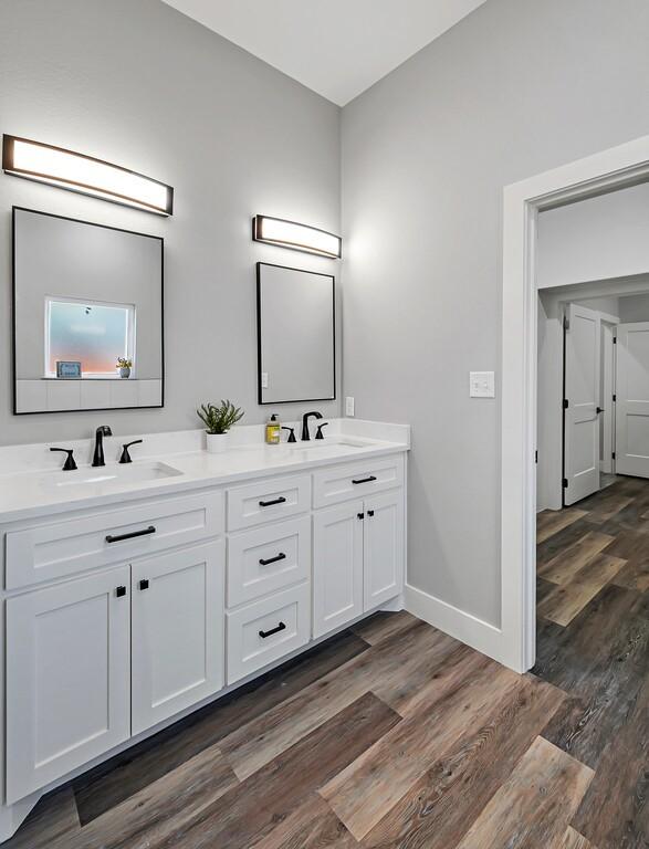 bathroom featuring hardwood / wood-style floors and vanity