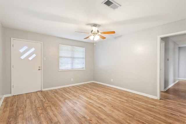 foyer with ceiling fan and light hardwood / wood-style floors