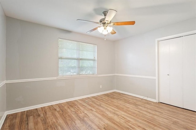 unfurnished bedroom featuring light wood-type flooring, a closet, and ceiling fan