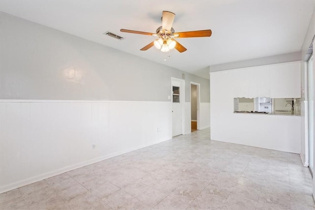 unfurnished living room with ceiling fan