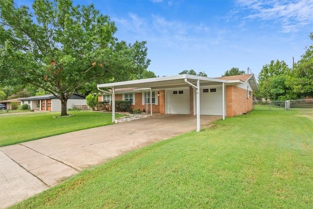 ranch-style house featuring a carport, a garage, and a front yard