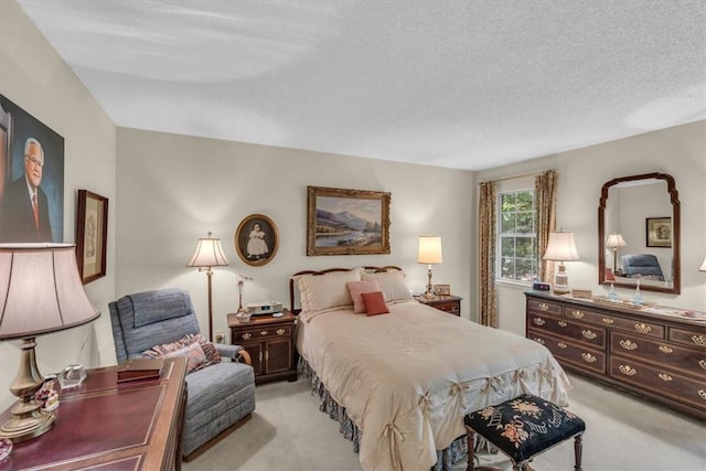 carpeted bedroom featuring a textured ceiling