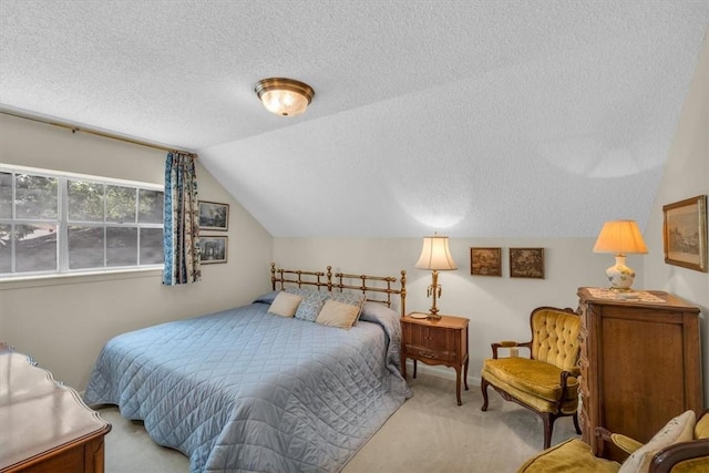 carpeted bedroom with lofted ceiling and a textured ceiling