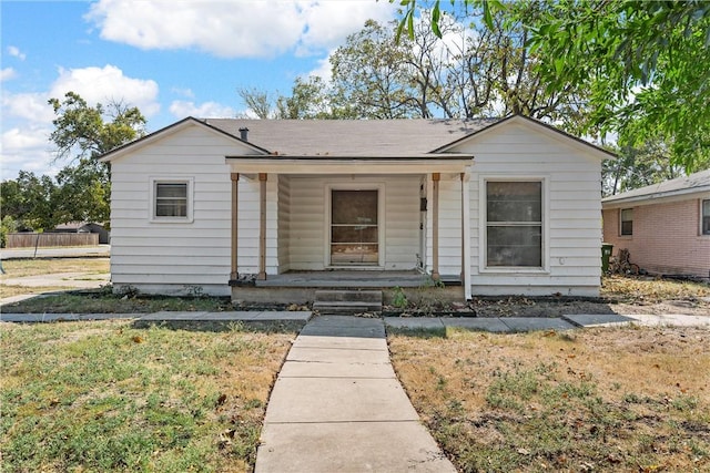 bungalow-style house featuring a porch and a front yard