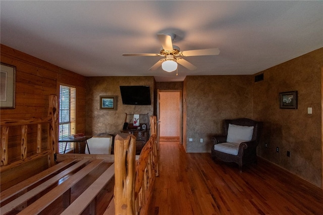 interior space featuring ceiling fan and wood-type flooring