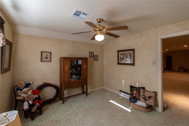 miscellaneous room featuring light colored carpet and ceiling fan