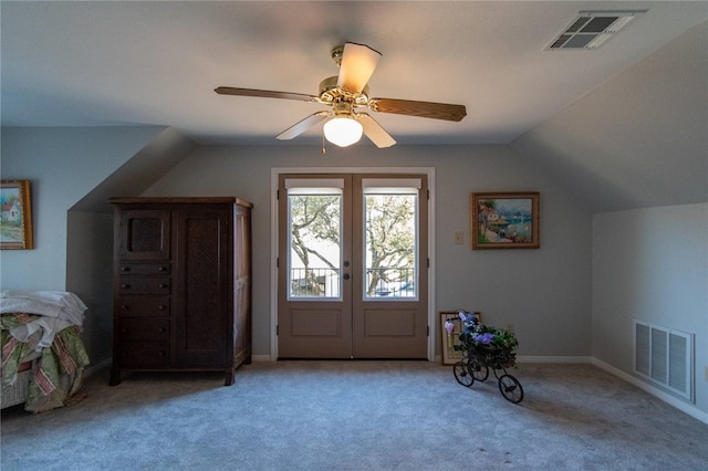 interior space featuring french doors, ceiling fan, and lofted ceiling