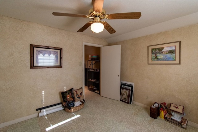 miscellaneous room with ceiling fan, carpet, and lofted ceiling