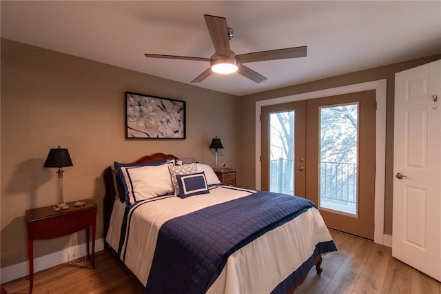 bedroom featuring ceiling fan, light hardwood / wood-style floors, access to exterior, and french doors