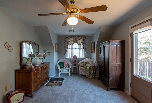 sitting room with ceiling fan and light colored carpet