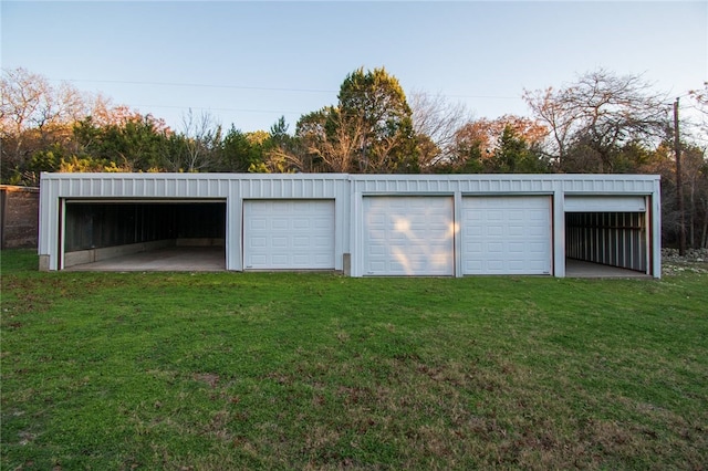 garage featuring a yard