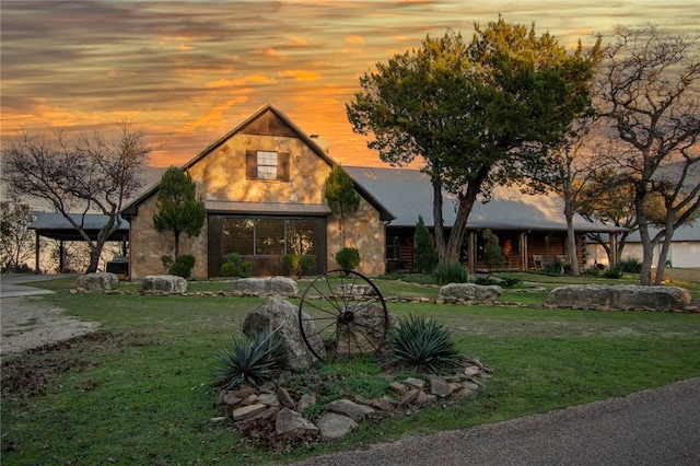 view of front of property with a lawn