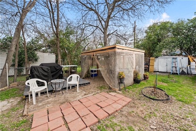 view of patio / terrace featuring a shed