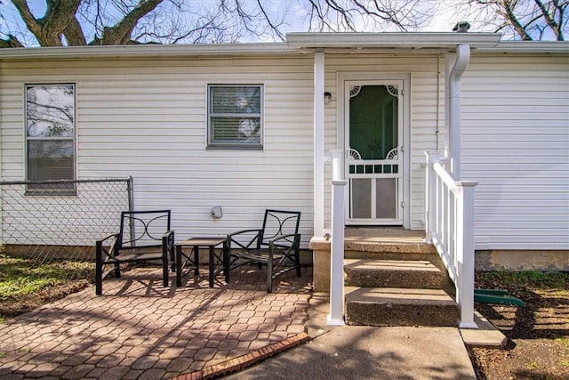 property entrance featuring a patio