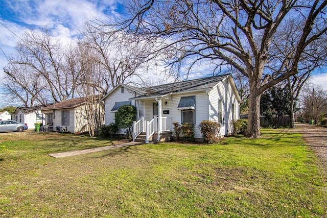 ranch-style home featuring a front yard