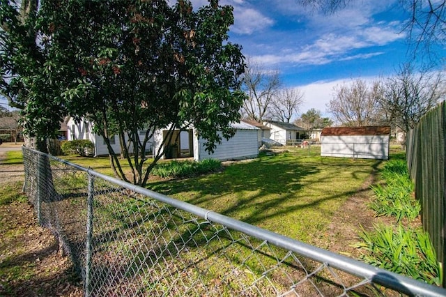 view of yard featuring a storage unit