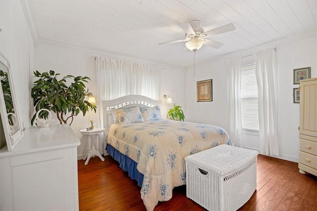 bedroom with ceiling fan, dark wood-type flooring, and crown molding