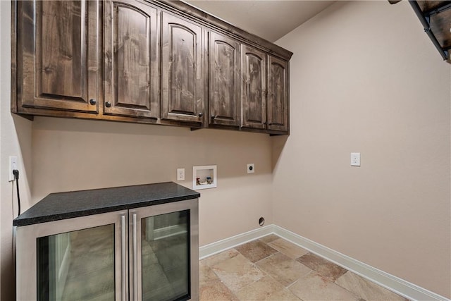 laundry area with wine cooler, hookup for a washing machine, cabinets, and hookup for an electric dryer