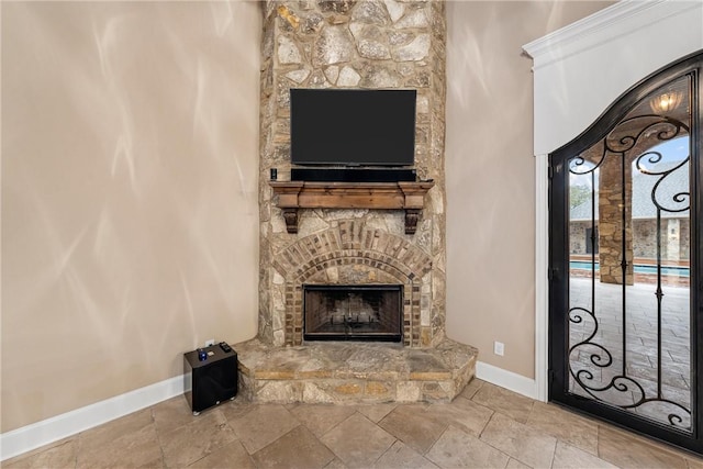 unfurnished living room with a stone fireplace