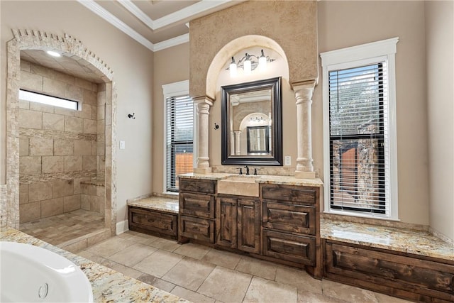 bathroom featuring decorative columns, vanity, and ornamental molding