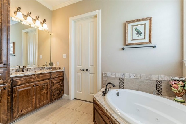 bathroom featuring tile patterned floors, vanity, ornamental molding, and tiled bath