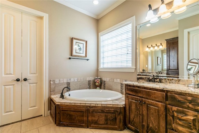 bathroom with a bathing tub, tile patterned flooring, vanity, and ornamental molding