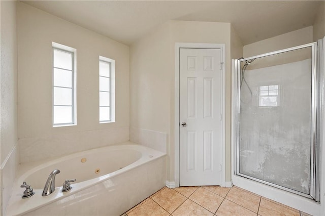 bathroom with tile patterned floors, separate shower and tub, and plenty of natural light