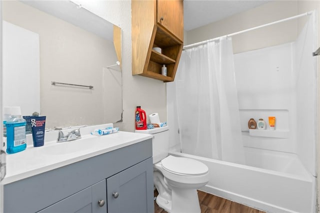 full bath featuring vanity, toilet, shower / tub combo, and wood finished floors