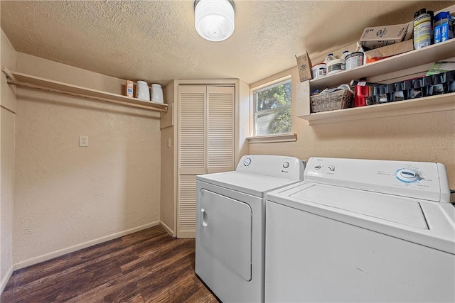 laundry area with a textured ceiling, dark hardwood / wood-style floors, and independent washer and dryer