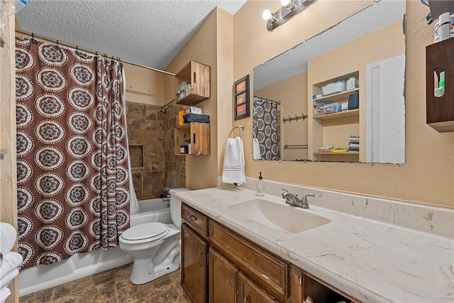 full bathroom featuring vanity, toilet, shower / bath combo with shower curtain, and a textured ceiling